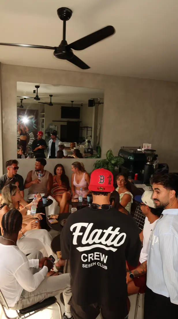 A full room at Flatto, a Flatto Crew Seseh Club shirt in the foreground
