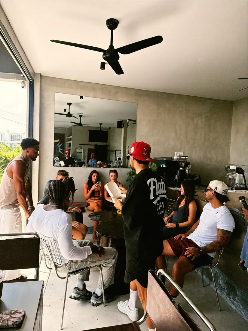 Guests sitting together in the open-air room at Flatto